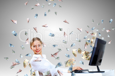 Businesswoman  at workplace and money symbols