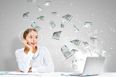 Businesswoman  at workplace and money symbols