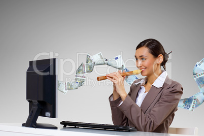 Businesswoman  at workplace and money symbols