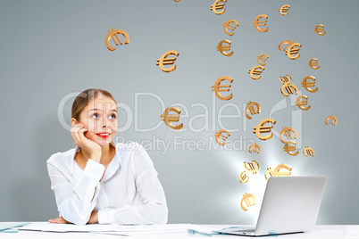 Businesswoman  at workplace and money symbols