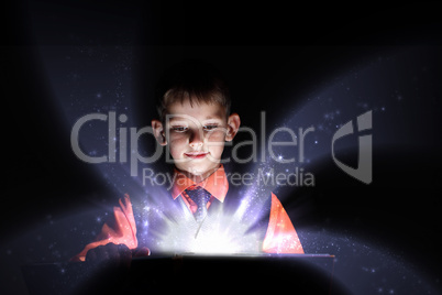 Child opening a magic gift box