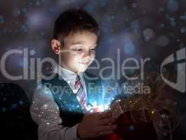 Child opening a magic gift box