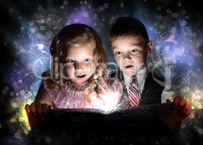 Children opening a magic gift box