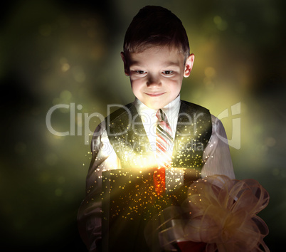 Child opening a magic gift box