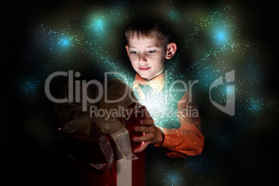 Child opening a magic gift box