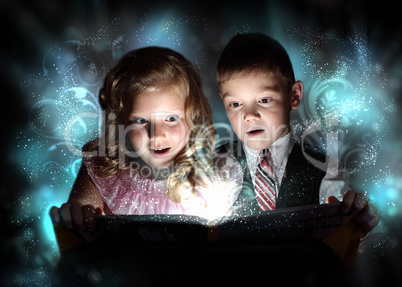 Children opening a magic gift box