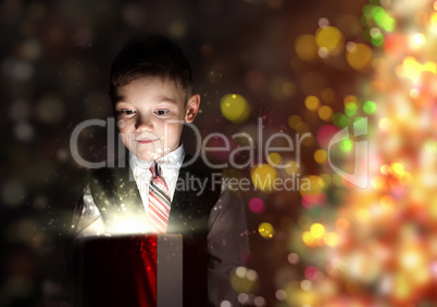 Child opening a magic gift box