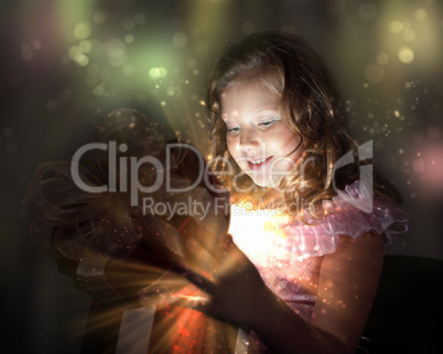 Child opening a magic gift box