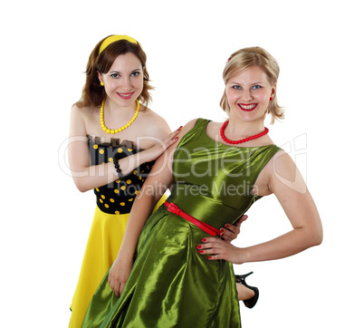 two young woman in bright colour dresses