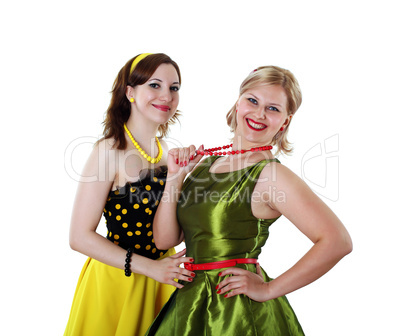 two young woman in bright colour dresses