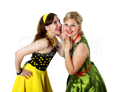 two young woman in bright colour dresses