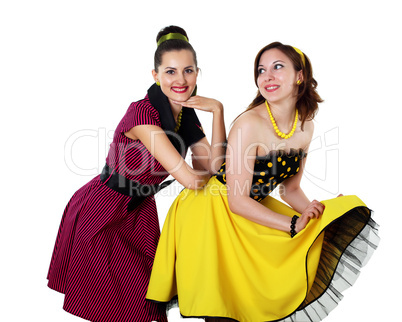 two young woman in bright colour dresses