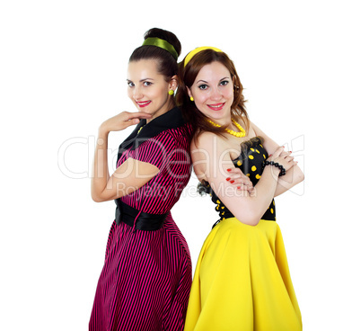 two young woman in bright colour dresses