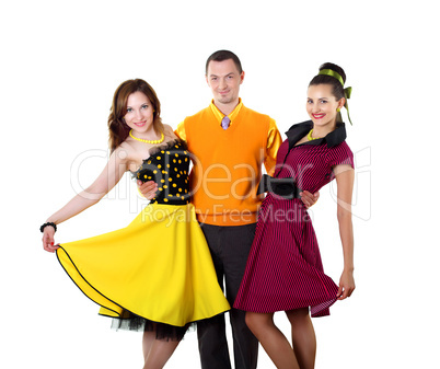 young man with two women in bright colour wear