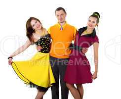 young man with two women in bright colour wear