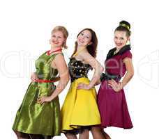 three young woman in bright colour dresses