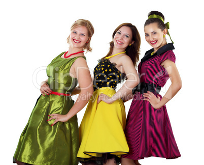 three young woman in bright colour dresses