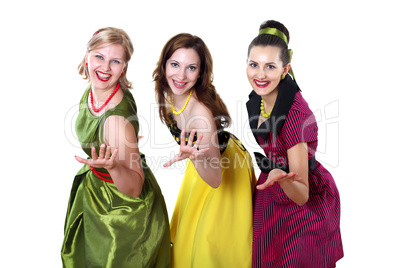 three young woman in bright colour dresses