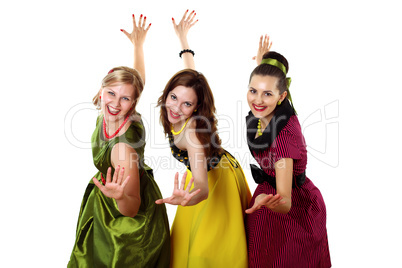 three young woman in bright colour dresses