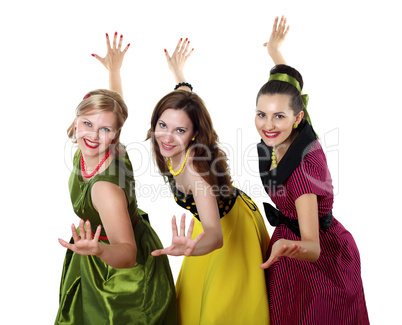 three young woman in bright colour dresses