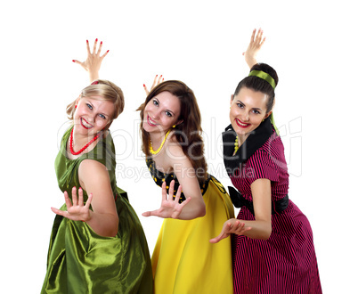 three young woman in bright colour dresses