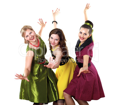 three young woman in bright colour dresses