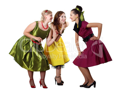 three young woman in bright colour dresses