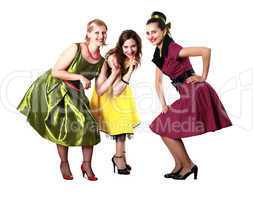 three young woman in bright colour dresses