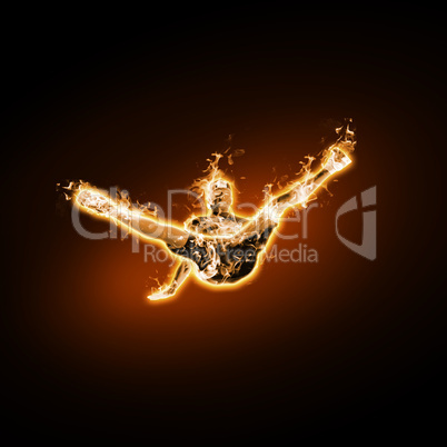 Fire dancer against black background