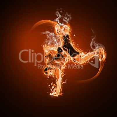 Fire dancer against black background