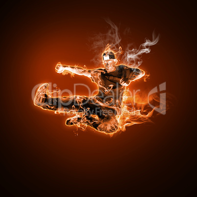 Fire dancer against black background