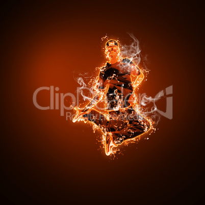 Fire dancer against black background