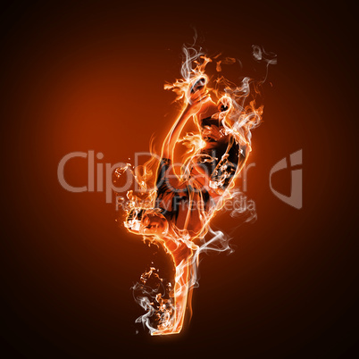 Fire dancer against black background