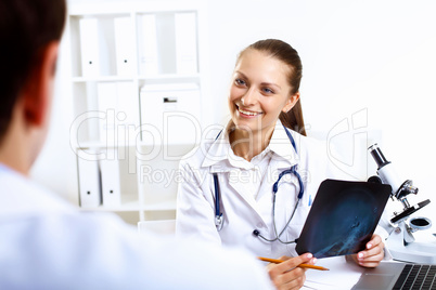 Friendly doctor in medical office