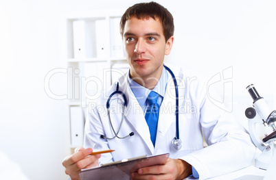 Friendly doctor in medical office