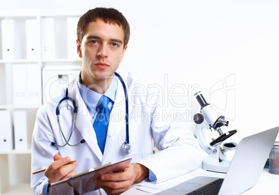 Friendly doctor in medical office