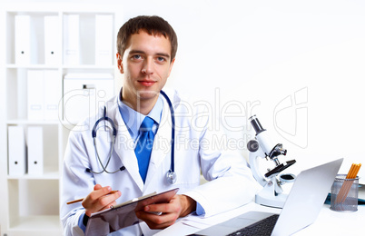 Friendly doctor in medical office