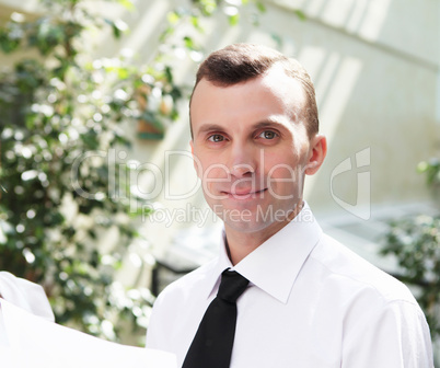 young businessman in the garden