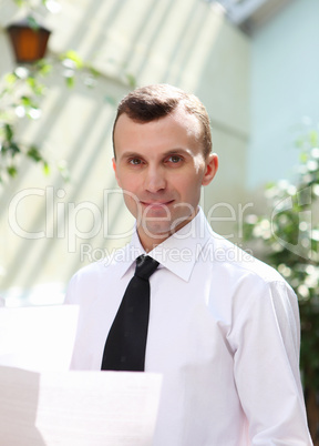 young businessman in the garden