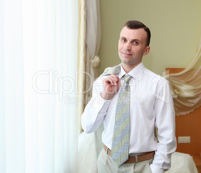 young businessman in hotel room