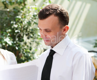 young businessman in the garden