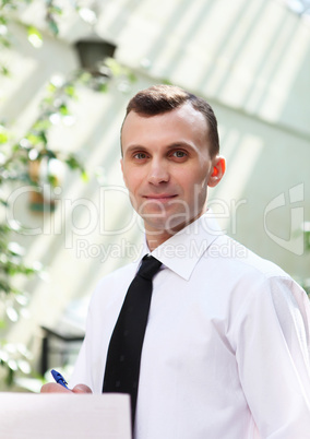 young businessman in the garden