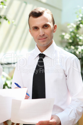 young businessman in the garden