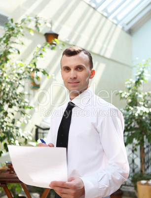 young businessman in the garden