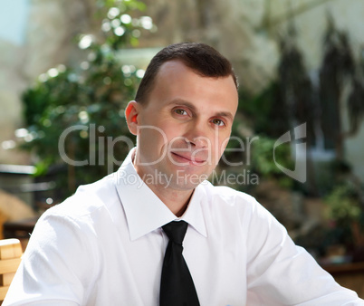 young businessman in the garden