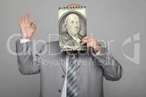 Bald young businessman with banknotes