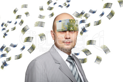 Bald young businessman with banknotes