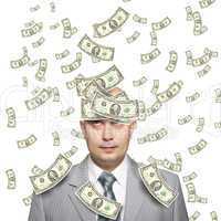 Bald young businessman with banknotes