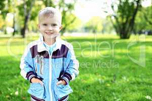 Little boy in summer park