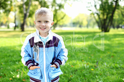 Little boy in summer park